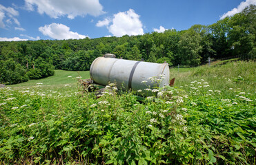 Idyllic green rural summer landscape with cattle watering tank. Seen in Germany in near Weissenohe...