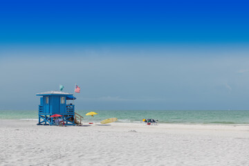 Siesta Key Beach, Lifeguard house on a beautiful summer day with ocean and blue cloudy sky in Florida USA - obrazy, fototapety, plakaty