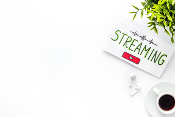 Streaming video concept - tablet on office workplace. Top view