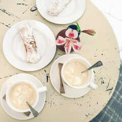breakfast with coffee and cookie, food on the table in cafe