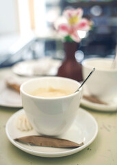 breakfast with coffee and cookie, food on the table in cafe