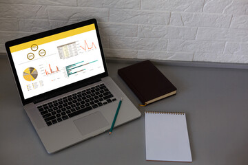 Laptop on table showing charts and graph, Analysis Business Accounting, Statistics Concept.
