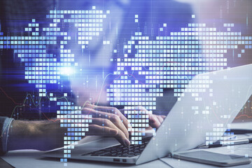 Multi exposure of businessman working on laptop on background. International business hologram in front. Concept of success.