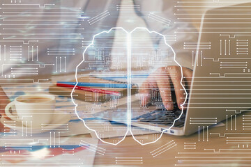 Businessman with computer background with brain theme hologram. Concept of brainstorm. Multi exposure.