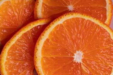 sliced fresh citruses and orange juice on the light rustic wooden surface. top view