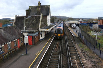 Fototapeta premium A train leaving Petersfield station in Hampshire, England.