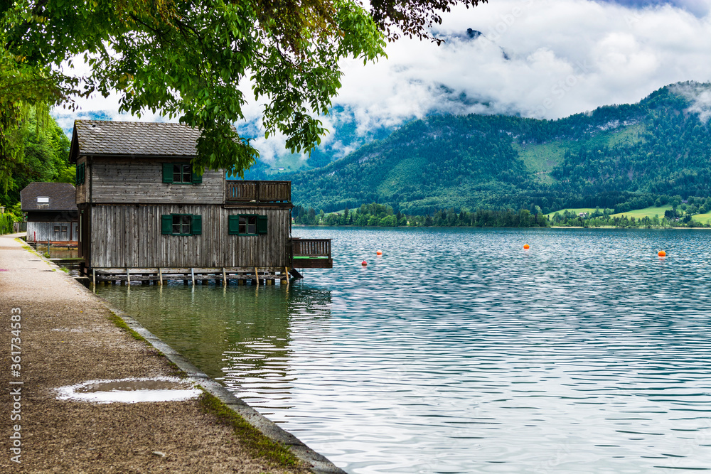 Wall mural Austrian landscape with boat hangars