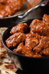 Chicken tikka masala served with bread naan