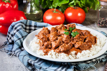 Chicken tikka masala served with rice