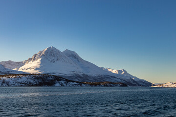mountains on the fjord near tromso
