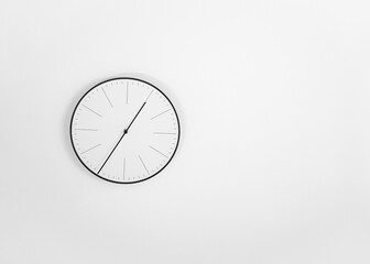 clock on the wall, white minimalist background, white wall