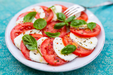 Caprese salad with tomatoes and mozzarella. Italian food.