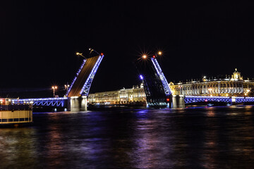 Fototapeta na wymiar Drawbridge across the Neva river in night Saint Petersburg