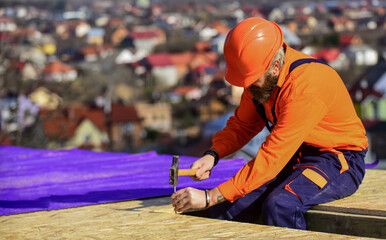 Roofer working. Roofer working tool. Construction Industry and Waterproofing. roofer working on...