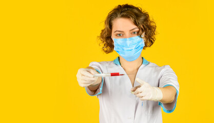 Doctor use syringe with vaccination for baby. wear respirator mask. medicine vial dose injection. medical injection against coronavirus. woman nurse with stethoscope. researcher holding flu vaccine