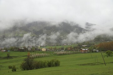 Fototapeta na wymiar Mountain green hill valley village view. Mountain village landscape. Savsat/Artvin/Turkey
