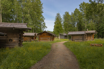 the old wooden buildings stand at the road