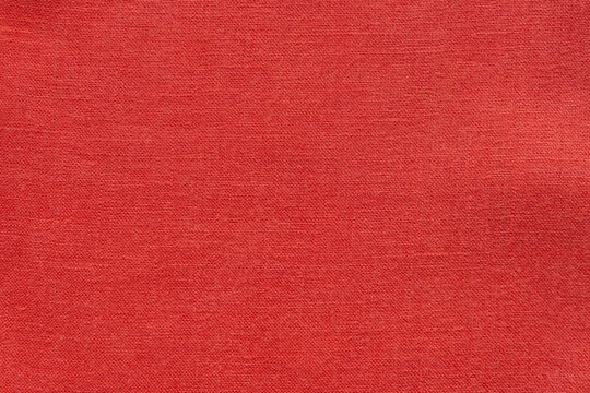 Red linen canvas fabric texture background