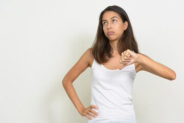 Portrait of stressed multi ethnic woman giving thumbs down