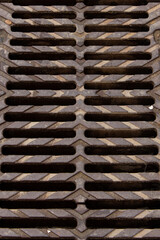 Drainage of the city, metal grate on the street