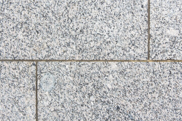 Stone granite tiles close up, city street