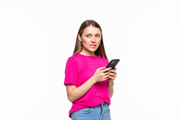 Smiling young girl text messaging on her mobile, isolated over white background