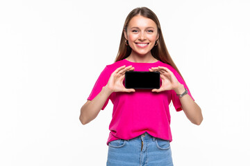 Fototapeta premium Portrait of a joyful swoman showing blank screen mobile phone isolated over white background
