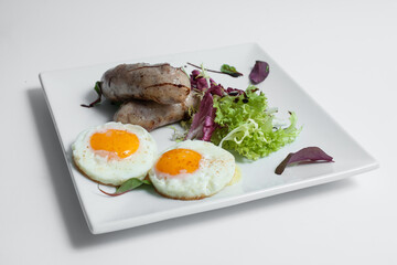 tasty and fresh fried scrambled eggs with sausages