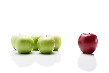 one red apple and many green isolated on white background 