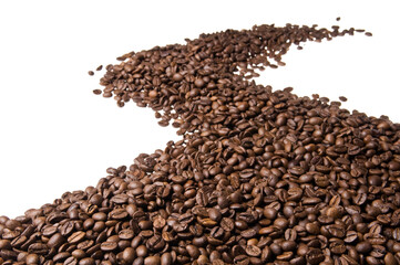 Roasted coffee beans isolated on white background. Close up of a brown surface texture of aroma black caffeine drink ingredient for coffee beverage.