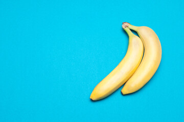 two banana isolated on color background,view of top,flatlay style