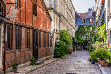 Paris, France - June 24, 2020: Passage Lhomme with its vegetation and its old workshops in Paris 11th district
