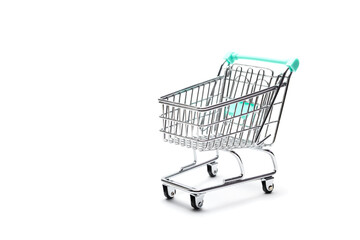 Miniature empty shopping cart on white  background