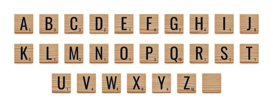 Alphabet letters on wooden pieces, classic board game.