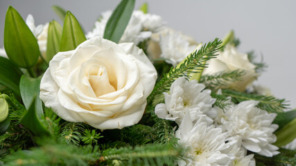 Beautiful white and green flower arrangement. White rose and chrysanthemum.