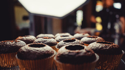 Unfinished elegant glamorous chocolate cupcakes. 