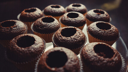 Unfinished elegant glamorous chocolate cupcakes. 