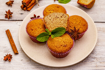 Homemade cupcakes with cinnamon, star anise and fresh mint. Autumn good mood, warm weather