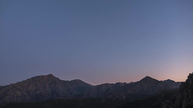 Day to night to day, holy grail time-lapse of the Milky Way passing over Monte Padro and Monte San Parteo in Corsica