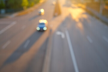 High angle view of defocused cars zooming on a road