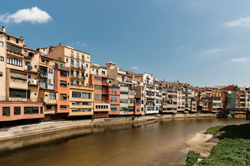 Fototapeta na wymiar Old architecture and colorful houses by the river in Gerona, Spain