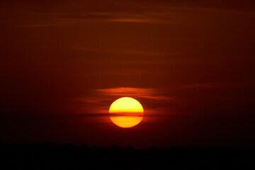 Fiery sunset and big sun