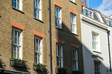 Fototapeta na wymiar Pretty buildings on a side street in London.