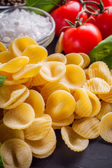 concept of traditional italian pasta with tomatoes and basil