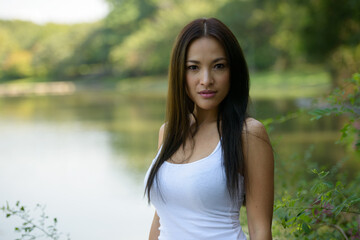 Portrait of beautiful Asian woman at the park outdoors