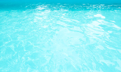 Surface of blue swimming pool. Background of blue ripped water in swimming pool