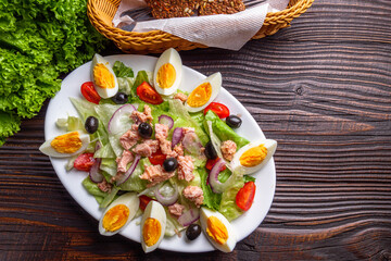 tuna salad on dark wooden rustic background