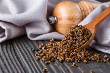 Sichuan pepper on a dark wooden rustic background