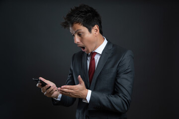 a man in a suit isolated on gray background