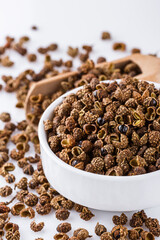 fragrant Sichuan pepper on white acrylic background